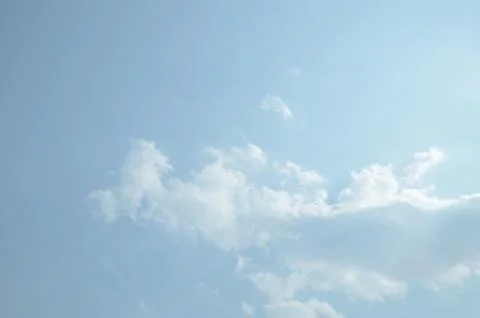 Blue sky with a cloud. Stock Photos