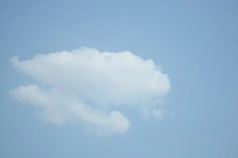 Blue sky with a cloud. Stock Photos