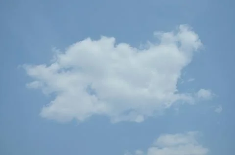 Blue sky with a cloud. Stock Photos