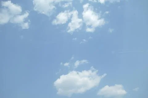 Blue sky with a cloud. Stock Photos