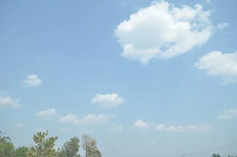 Blue sky with a cloud. Stock Photos
