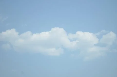 Blue sky with a cloud. Stock Photos