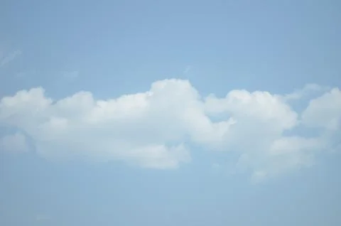 Blue sky with a cloud. Stock Photos