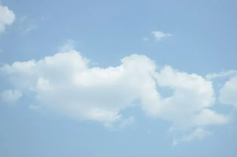 Blue sky with a cloud. Stock Photos