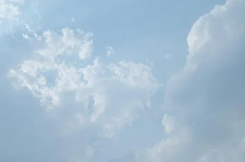 Blue sky with a cloud. Stock Photos