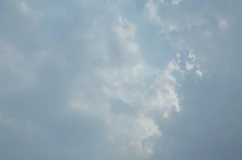 Blue sky with a cloud. Stock Photos