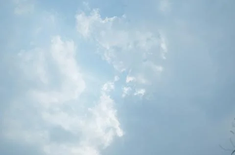 Blue sky with a cloud. Stock Photos