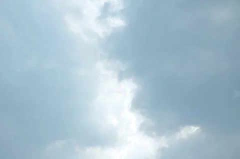 Blue sky with a cloud. Stock Photos