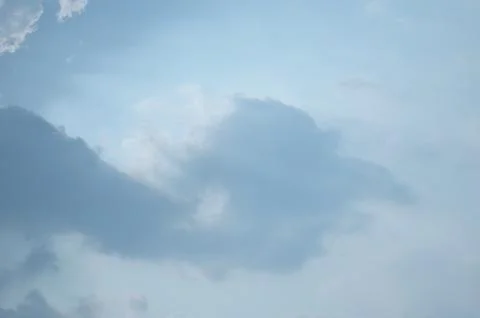 Blue sky with a cloud. Stock Photos