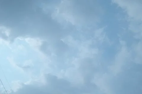 Blue sky with a cloud. Stock Photos