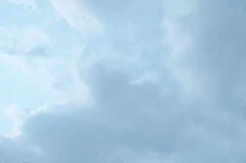 Blue sky with a cloud. Stock Photos