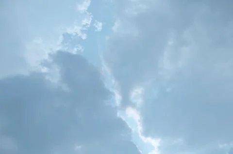 Blue sky with a cloud. Stock Photos