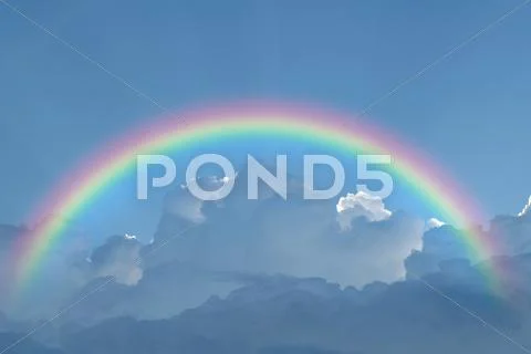 Blue sky cloud with rainbow Stock Photos