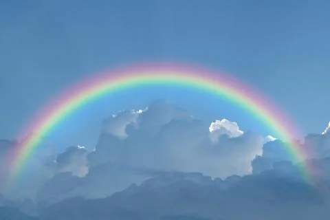 Blue sky cloud with rainbow Stock Photos