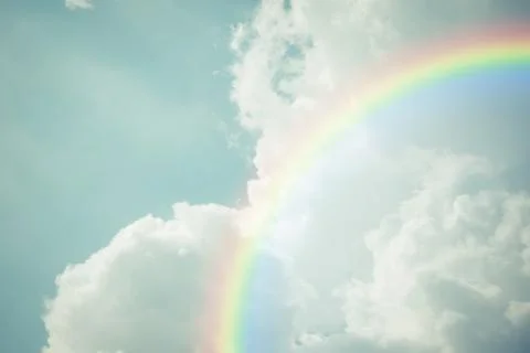 Blue sky cloud with rainbow , process in vintage style Stock Photos
