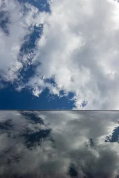 Blue Sky with Cloud Reflections on Modern Glass Structure Stock Photos