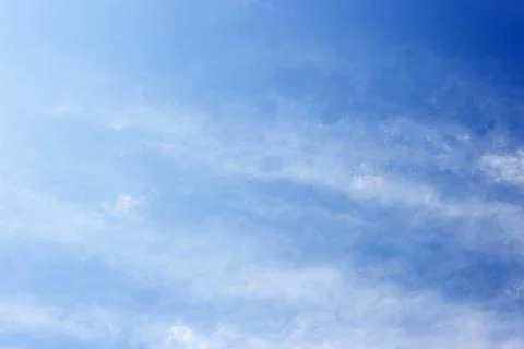 Blue sky with cloud trails Stock Photos