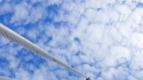 A blue sky with clouds and a black background Stock Footage 274031040