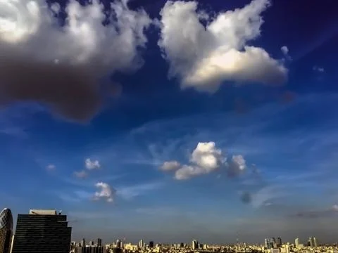 Blue sky clouds and building Stock Photos