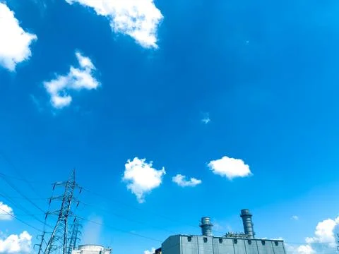 Blue Sky with Clouds and Power Lines, Industrial Landscape Featuring White Stock Photos