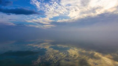 Blue sky with clouds and reflection for background. Lake Balaton of Hungary Stock Photos