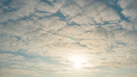 Blue sky with clouds and sun. Beautiful natural background, Clouds at sunrise. Stock Footage 165795611