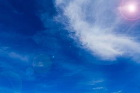 Blue sky with clouds and sun. Foto stock
