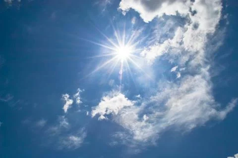 Blue sky with clouds and sun Foto stock
