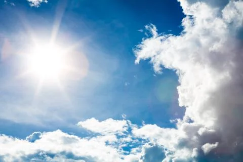 Blue sky with clouds and sun Stock Photos