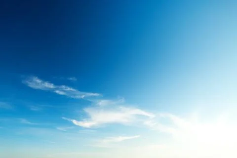Blue sky with clouds and sun 스톡 사진