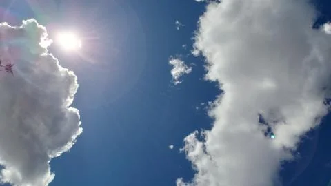 Blue sky with clouds and sun Stock Photos