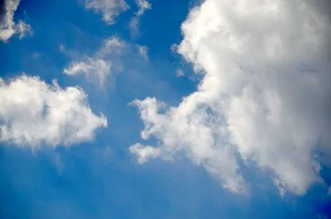 Blue sky with clouds background and texture. Stock Photos