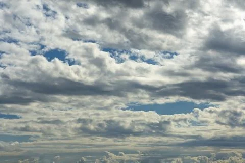 Blue sky, clouds, background, beautiful landscape with heavy thunderclouds... Stock Photos