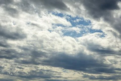Blue sky, clouds, background, beautiful landscape with heavy thunderclouds... Stock Photos
