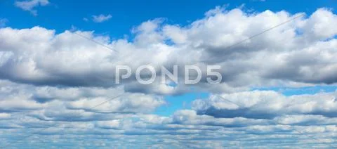 Blue sky with clouds background Stock Photos