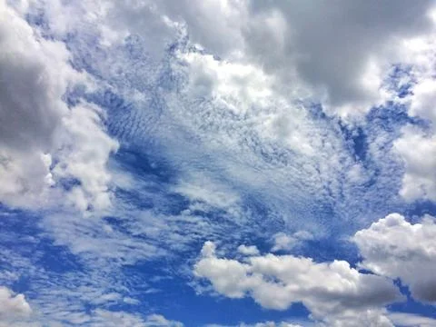 Blue sky with clouds background. Stock Photos