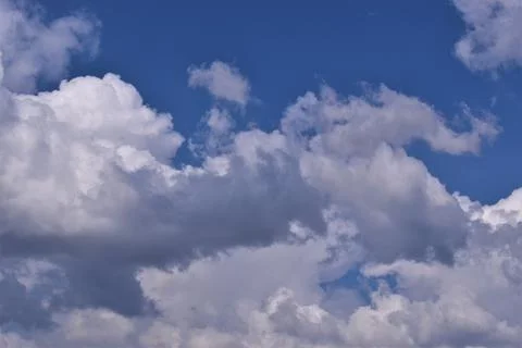Blue sky with clouds background Stock Photos