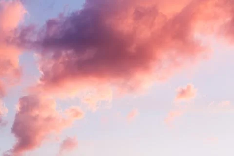 Blue sky clouds, background of purple sunset sky. Stock Photos