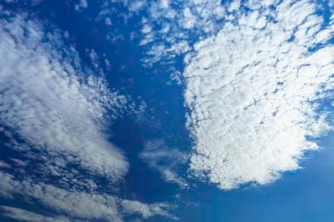 Blue sky with clouds. Beautiful background. Stock Photos