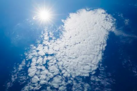 Blue sky with clouds. Beautiful background. Stock Photos
