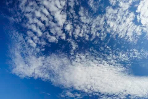 Blue sky with clouds. Beautiful background. Stock Photos