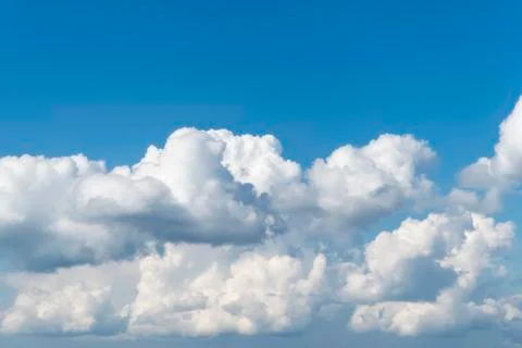 Blue sky with clouds below, as background Stock Photos