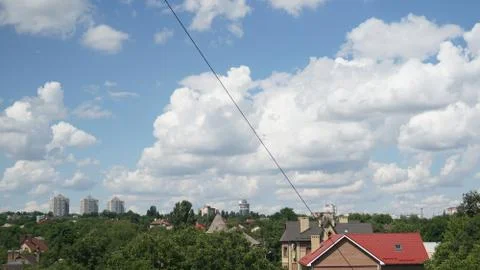 Blue sky with a clouds in a clear day over city background Foto stock