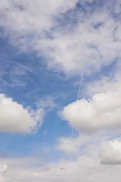 Blue sky with clouds close-up. Vertical snapshot Stock Photos