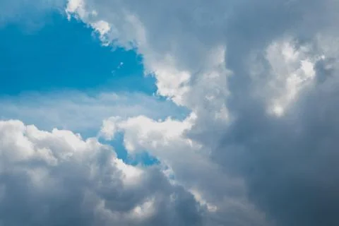 Blue sky with clouds. Clouds in the blue sky. Stock Photos