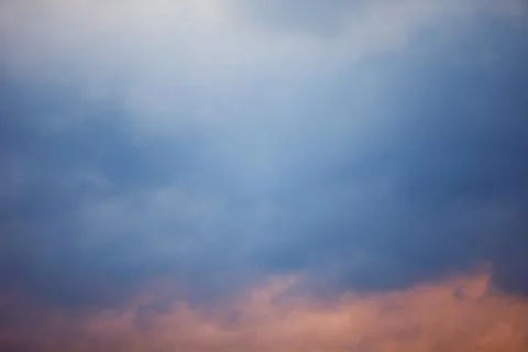 Blue sky with clouds. Clouds in the dark sky. Stock Photos