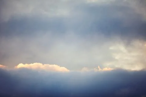 Blue sky with clouds. Clouds in the dark sky. Stock Photos