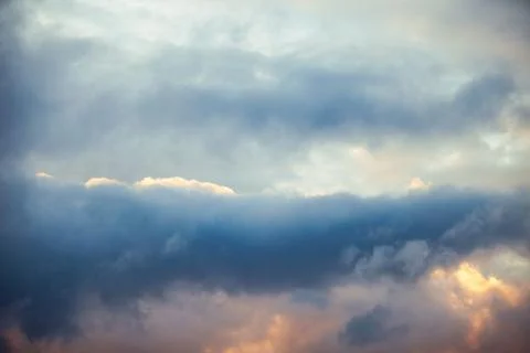 Blue sky with clouds. Clouds in the dark sky. Stock Photos