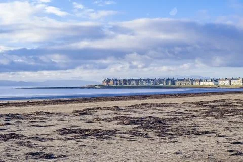 Blue sky clouds drift above calm sea waters Stock-Fotos