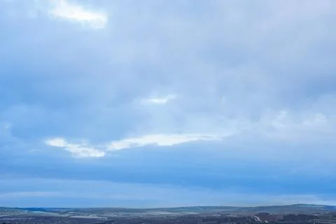 Blue sky with clouds during winter in the village Stock Photos